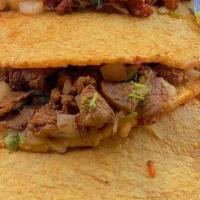 Mulita Pacman · Two stacked handmade Corn tortilla with monterey
cheese, Onion & Cilantro and your choice of...