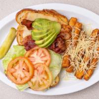 California Chicken Sandwich · A charbroiled chicken breast, crisp bacon, fresh avocado, and melting Swiss cheese. Served o...