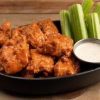 Wings Boneless Buffalo · served with boneless wings, celery, carrots, choice of house ranch (245 cal) or bleu cheese ...