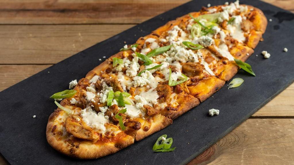 Buffalo Chicken · spicy pulled chicken, classic buffalo sauce, mozzarella,. provolone, crumbled blue cheese, smoked onion ranch, scallions
