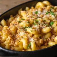 Mac And Cheese · creamy four cheese sauce, cheddar, mozzarella and provolone cheeses, parmesan, spiced Rice K...