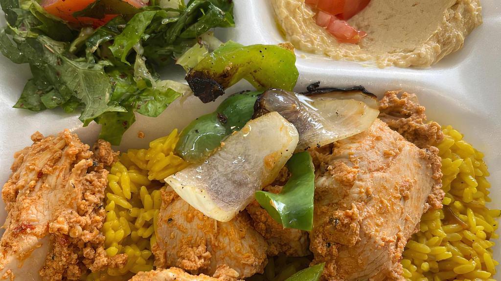 Chicken Kabab Plate · Chicken breast kabab over rice, fattoush side salad, hummus, side of garlic