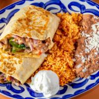 Fajita Burrito · Grilled bell peppers, onions, whole pinto beans, Monterey jack cheese, sour cream. Add shred...