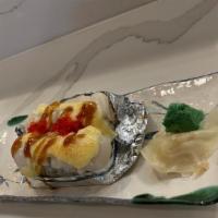 Baked Scallop Roll · Snow crab and avocado topped with baked scallop masago and our delicious baked sauce.