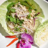 Lettuce Wraps · Minced chicken or tofu tossed with mint, chili, lime juice, and rice powder.  Served with fr...
