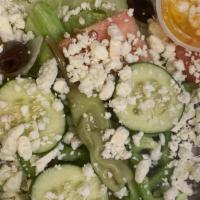 Greek Salad · Lettuce, green peppers, tomato, red onions, cucumbers. olives,  and feta cheese, served with...