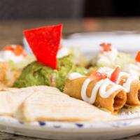 Frida Platter · Two crispy taquitos (chicken and potato), quesadillas, sopes, and fresh guacamole.