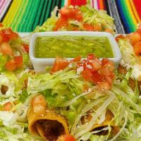 Crispy Taquito · Two chicken and two potato filled crispy rolled tortillas, topped with lettuce, sour cream, ...