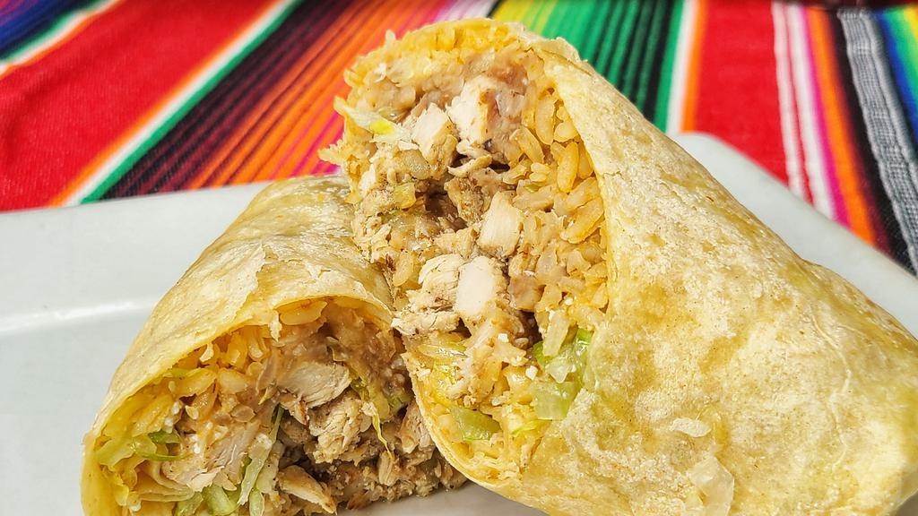 Burrito Frida Or Burrito Bowl · Your choice of chicken, steak, carnitas, pastor, veggies, or shrimp wrapped in a flour tortilla with rice, beans, cotija cheese and lettuce. Served with a side of rice and beans.