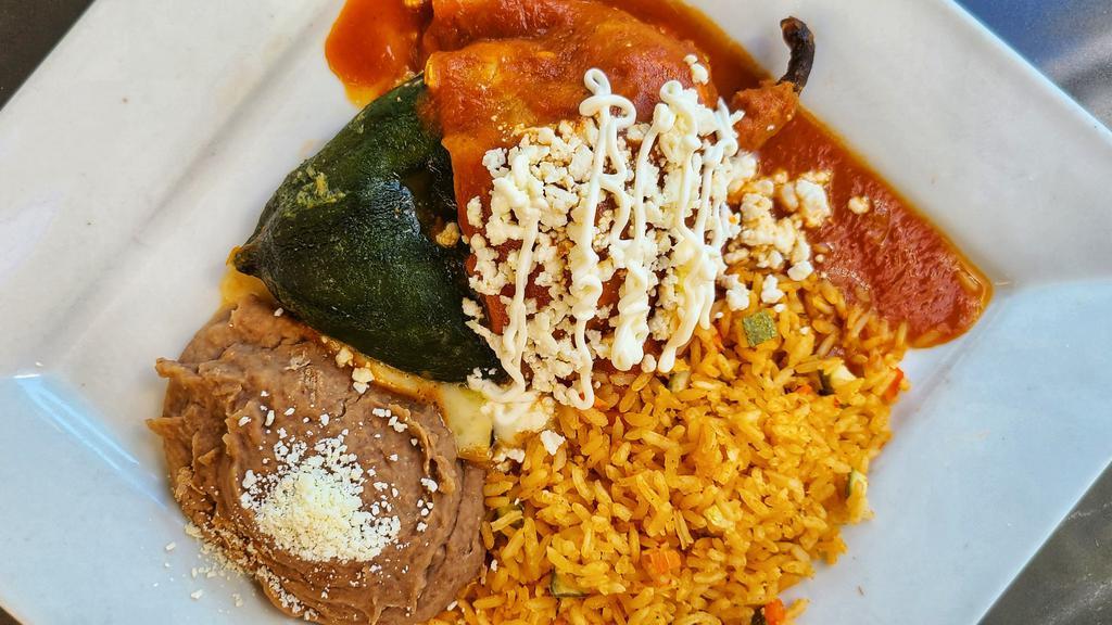 Chile Relleno · Egg battered poblano pepper stuffed with melted monterey jack cheese and corn kernels, covered with a tomato sauce. Served with rice and refried beans.