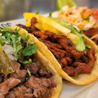 Tacos · Your choice of three tacos.  All tacos served on handmade soft corn tortillas with Mexican r...