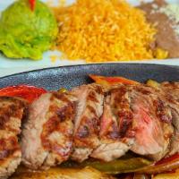 Steak Fajitas · Chef's favorite. Grilled tenderloin strips with sautéed tomatoes, green bell peppers, and on...