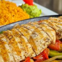Chicken Fajitas · Grilled chicken tenders with sautéed tomatoes, green bell peppers, and onions. Served with r...