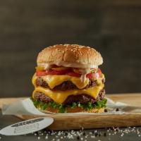 New York Style Double · Black Angus ground beef burgers (2) on a sesame bun topped with cheddar, bacon, lettuce, tom...