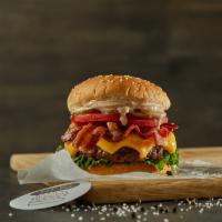 Bacon Cheeseburger · Black Angus ground beef burger on a sesame bun topped with cheddar, bacon, lettuce, tomatoes...