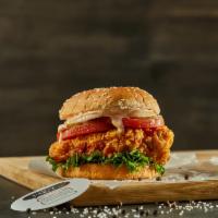 Crispy Chicken Sandwich · Crispy chicken on a sesame bun topped with tomato, coleslaw, pickles, and giant sauce