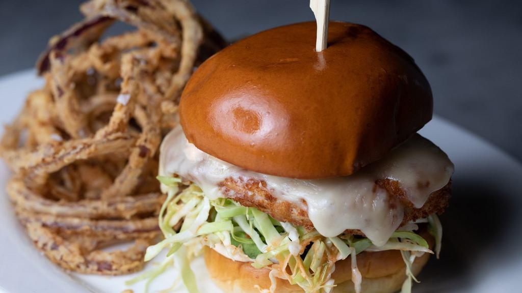 Crispy Chicken Sandwich · Coleslaw, pickles, olives, avocado, spicy aioli, Fontina cheese - fries.