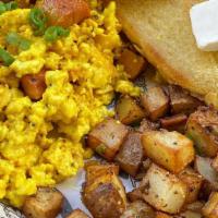 Hooligan Breakfast Platter · Tofu scramble infused with JustEgg , diced up franks, home style potatoes and 2 slices of bu...