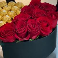 Sweetheart Box · Heart shaped box filled with chocolate and roses.