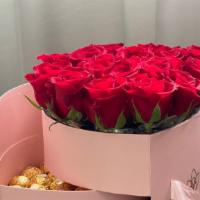 Heart Box With Flowers And Chocolate  · Roses and Ferrero Rocher.
Opens, and the flowers are inside.