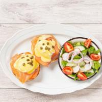 Salmon Eggs Benedict · Poached eggs on a toasted English muffin, smoked salmon, creme fraiche, fried capers, hollan...