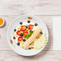 Breakfast Parfait · Greek yogurt, granola and seasonal fruits.