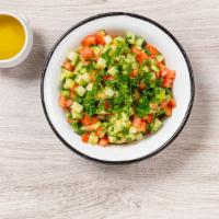 Chopped Salad · Vegan, gluten free. Diced cucumber and tomato with lemon mint dressing and fresh parsley.