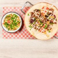 Sinia Kebab · Five grilled beef and lamb served in freshly baked focaccia with smoked eggplant, tomatoes a...