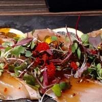 Yellowtail Carpaccio · Sliced yellowtail, jalapeño, mixed vegetables, yuzu ponzu sauce.