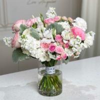 Bouquet In A Glass Vase · An elegant bouquet with pink roses, white matthiolas, and other flowers to complete the comp...