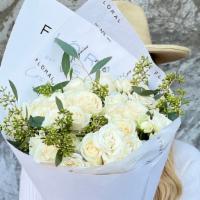 White Dreams · Dreamy bouquet with White Roses and Eucalyptus in our signature paper wrap.