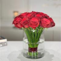 14 - Classic Red Roses In A Glass Vase · A bold single flower kind arrangement featuring 25 stems of classic red Roses in a glass vase.