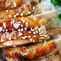 Teriyaki Chicken · Grilled chicken topped with teriyaki sauce. Served with steamed broccoli, carrots, and cabba...