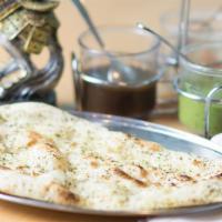 Plain Naan · Traditional Indian bread baked in a tandoori oven.