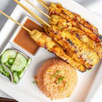 S-4. Chicken Sate · Skewered and marinated chicken breast, grilled and served with a side of cucumber salad and ...