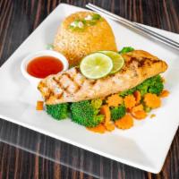 S-6. Grilled Salmon · Grilled and marinated salmon fillet served with a side of steamed broccoli.