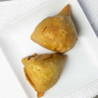 Vegetable Samosa · Pastry sheet stuffed with green peas and potato plus spices.