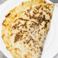 Plain Naan · Vegetarian. A traditional butter glazed bread made with refined wheat flour cooked in a tand...
