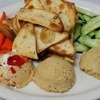 Hummus (Mini) · Roasted red pepper, southwestern, and roasted garlic hummus. Served with homemade herb chips...