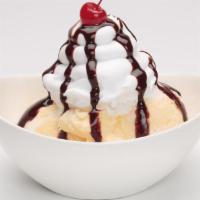 Old Fashioned Sundae · Vanilla ice cream layered with caramel or chocolate sauce, whipped cream and a cherry.