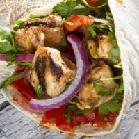 Chicken Kebab Wrap · Juicy chicken kebabs, lettuce, tomatoes, garlic sauce, and house dressing wrapped in a warm ...