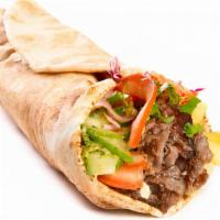 Beef Kebab Wrap · Juicy beef kebabs, lettuce, tomatoes, hummus and house dressing wrapped in a warm pita serve...