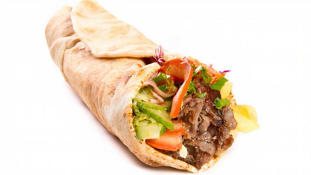 Beef Kebab Wrap · Juicy beef kebabs, lettuce, tomatoes, hummus and house dressing wrapped in a warm pita served with choice of 1 side.
