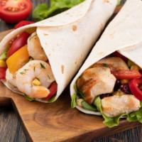 Shrimp Wrap · Hearty shrimp, fattoush, rice, lettuce, and green sauce wrapped in a warm pita served with c...