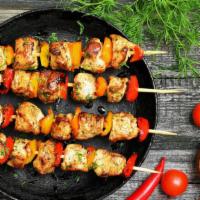 Chicken Kebab Plate · Chicken breast kebabs served with warm pita bread + choice of rice or house salad + choice o...