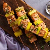 Salmon Kebab Plate · Tender salmon kebabs served with warm pita bread + choice of rice or house salad + choice of...
