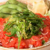 Poke Tuna Sushi Bowl · Spicy tuna and seaweed on top. Comes with green onions and sesame seeds on top.