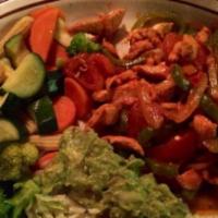 Chicken Fajitas · Sliced chicken breast sautéed with tomatoes, onions, white wine, green bell peppers and achi...