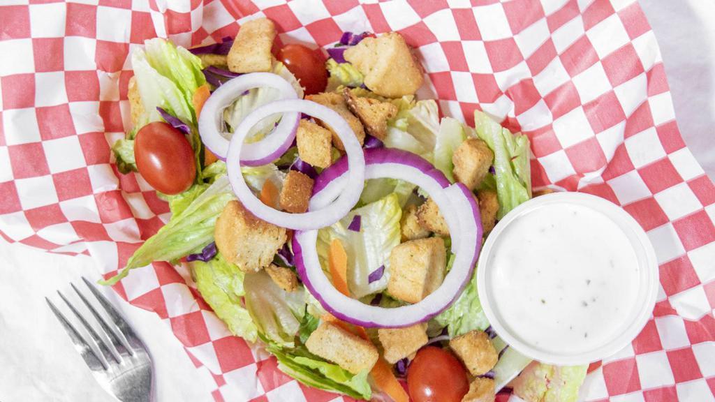 Garden Salad · A fresh, crisp bed of lettuce topped with carrots, cabbage, onions, cherry tomatoes and croutons. Served with your choice of dressing on the side (Blue Cheese, Ranch, Honey Mustard, Italian or Thousand Island)