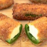 Jalapeño Poppers · Mild jalapenos stuffed with fresh cream cheese and coated with a crunchy potato breading.